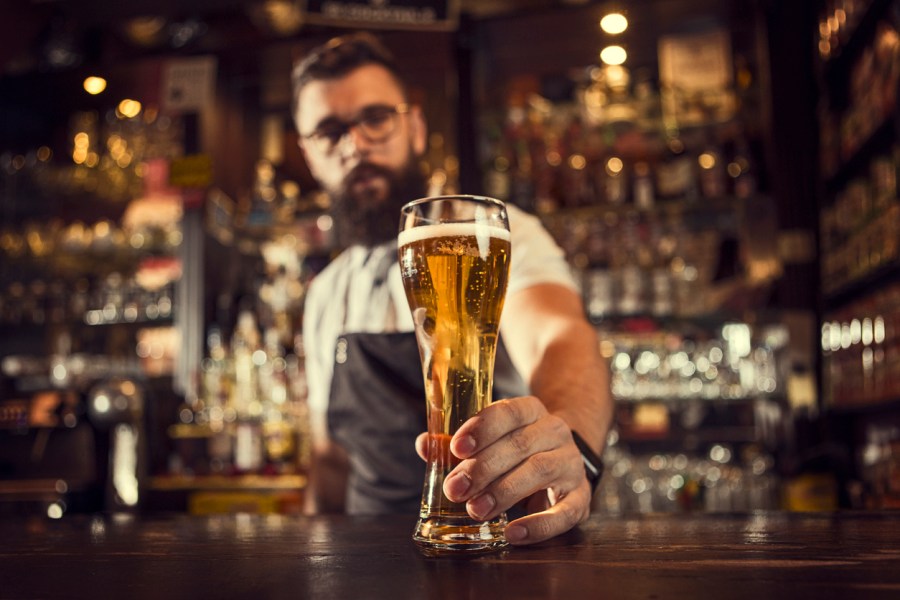 Bartender serving beer